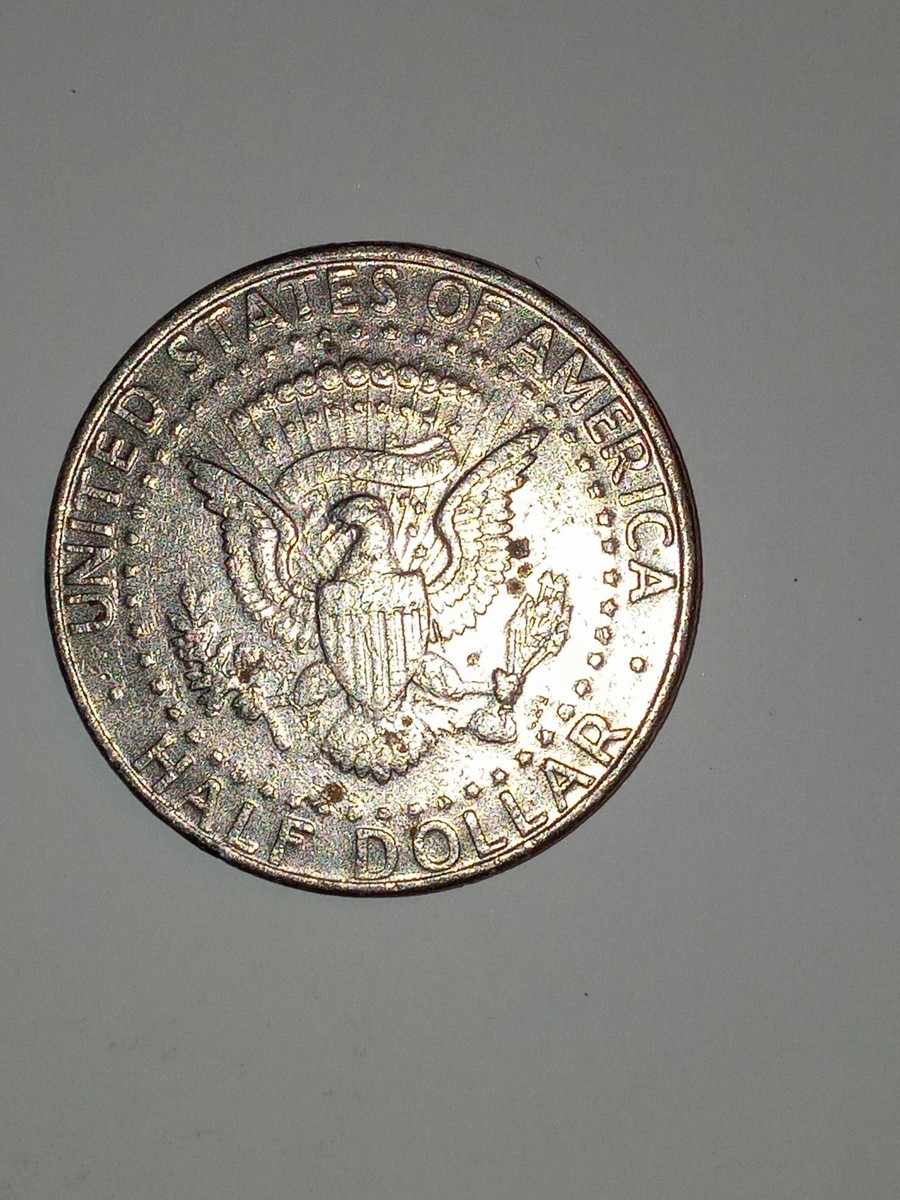1990 Kennedy Half Dollar No FG error variety — missing Frank Gasparro initials below eagle's left leg on reverse