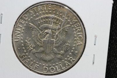 1990 Kennedy Half Dollar clipped planchet error showing missing section of metal on coin edge