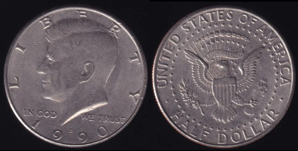 1990 Kennedy half dollar mint production — three specimens showing P, D, and S proof varieties side by side